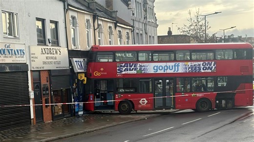 Double-decker bus crashes into shop in East London