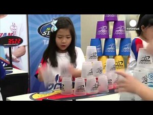 Mini cup stacking world champions show off their lightning-speed skills