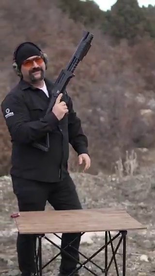 my character in fallout 76 pulling her weapon out of her backpack that clearly does not fit in the backpack but also does not stow on my back when im not holding it