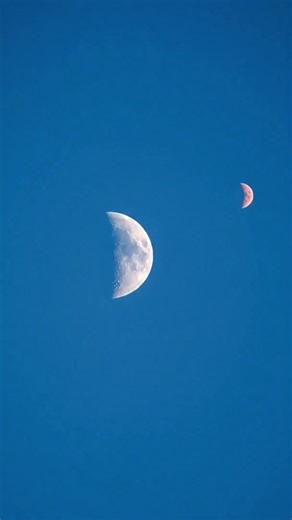 Two moons appearing in the blue daytime sky! #NASA #Space #Astronomy #Science #SpaceExploration #Trending #Reels #Galaxy #Moon #Stars #Cosmos #SpaceX #Astrophotography #Photography #Love #TBT #WinterSeason #MLKD | Space Voyager