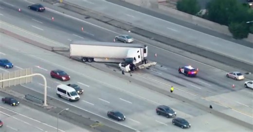 Semi truck crashes through center divider of 118 and 405 freeway transition in Granada Hills