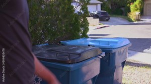 Man throwing garbage in the trash can. Separation of waste into waste and recycling Stock Video