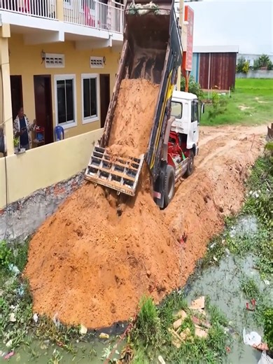 2.2K views · 14 reactions | Starting a new landfill project in a flooded area! Truck team unloading, bulldozer pushing stone — mixed action video | JoJo Construction | Facebook