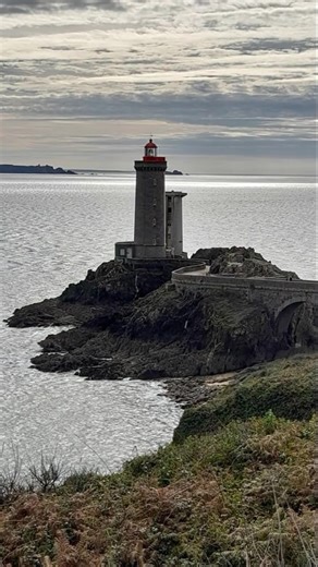 Stone Lighthouse on a Rocky Coast | Lighthouse Love