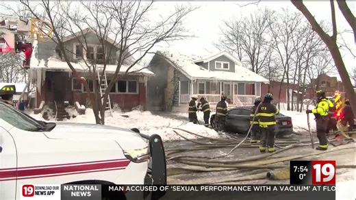 Cleveland firefighters save woman from roof of house fire on city’s west side