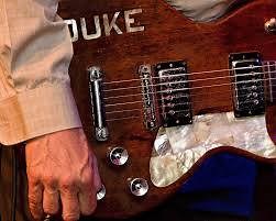 Dr. Duke Tumatoe & The Power Trio September 8 @ 210 @ 9PM! Plus blues master Tom Holland at 7PM! Chicago-born Duke Tumatoe is a musician/showman who has retained a firm career by fusing gritty R&B, rock, blues, and funk injected with equal parts humor and gut-level sincerity. Tumatoe was a founding member of what would become REO Speedwagon. Throughout his illustrious career, Tumatoe opened for several legendary figures in blues and rock, including Muddy Waters, Buddy Guy, B.B. King, George Thor