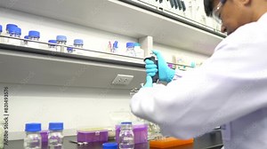 Scientist in lab,conducting experiments,analyzing results,developing industrial solutions,advancing research,contributing to scientific progress