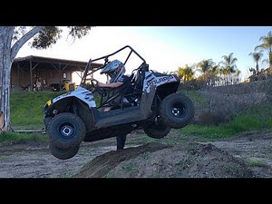 8 YEAR OLD DRIVING A RZR!!!