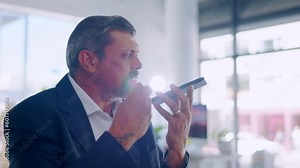 Employee, phone call and man with anger speaker and frustrated with communication, shouting and connection. Male worker, angry professional and consultant with a cellphone, loudspeaker and screaming