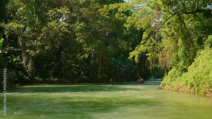 Rafting. Martha Brae Rafting Village. Martha Brae River. Rafting on the Martha Brae. Montego Bay, Jamaica. Wooden bamboo raft.