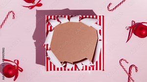 Unwrapping gift revealing space for text. Stop Motion Animation. Mockup for discounts, text etc