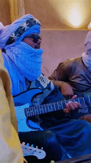 ASIDD ⴰⵙⵉⴷⴷ on Instagram: "Desert Blues is not merely a melody, but the echo of the sands and the nostalgia of caravans stretching through time. Its strings flow like the desert winds, carrying stories of patience, wandering, and the majesty of the void. It is the language of silence when the night decides to sing, turning solitude into a timeless cosmic masterpiece."