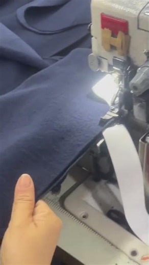 the process of sewing labels onto fabric using a sewing machine#handmade #machine #youtubeshorts