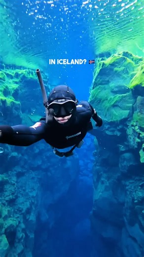 Asa Steinars on Instagram: "Did you know you can swim between two continents in Iceland? Like… actually float between North America and Europe. In water so clear it feels fake. 🇮🇸 I did it. And it honestly blew my mind. The place is called 📍 Silfra fissure and it’s a crack between two tectonic plates, filled with melted glacier water. Freezing cold. In the middle of a national park. Not exactly inviting 😅 From above it doesn’t look like a thing special. But the moment you get in… everything