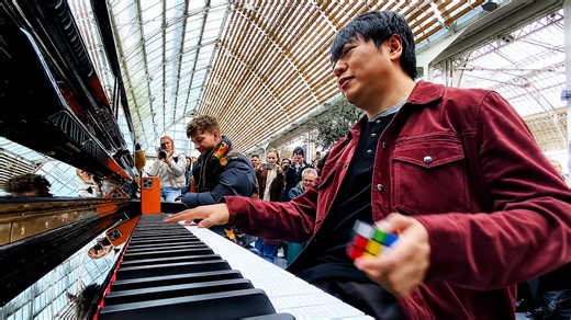 This train station piano performance turns into a battle