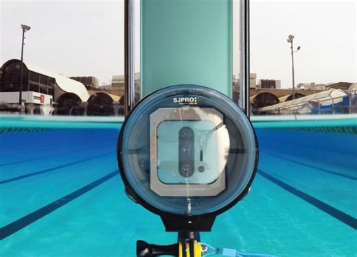 Domed waterproof phone case takes half above and half below the water