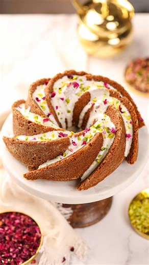 Shilpa | Vanilla Trails on Instagram: "Let’s bake this beautiful and absolutely delicious Persian Love Cake. This easy recipe is egg free, made with Whole wheat Flour, flavoured with Lemon, Cardamom, Rose and topped with a healthier yogurt based glaze. A cake so aromatic and full of bold flavours that it was named a Love Cake! It is just the perfect treat for Valentine’s day, isn’t it?! What makes this recipe even more special is the pure copper, bronze and brass utensils from @ptal.in that I ha