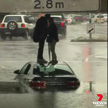 Heavy rain has caused chaos across Melbourne, with flash flooding in the suburbs and the city. Two people had to take refuge on the roof of their car after getting caught in floodwater under the York Street Bridge in South Melbourne. 7NEWS at 6pm | More: https://7news.link/3RIfDde #7NEWS | 7NEWS Melbourne