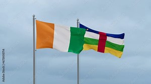 Central African Republic flag and Ivory Coast, Cote d'Ivoire flag waving together on cloudy sky, endless seamless loop, two country relations concept