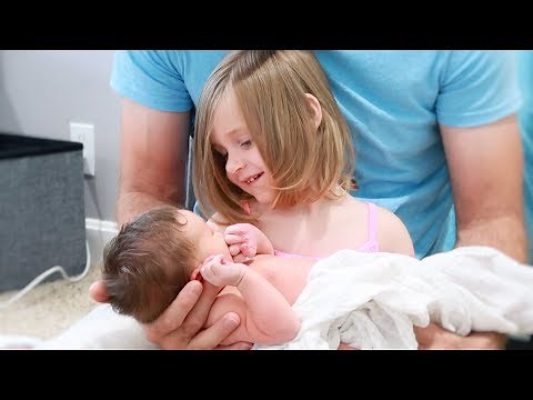 Big Sister Holding Newborn Baby Brother For The First Time | Sweetest Thing Ever