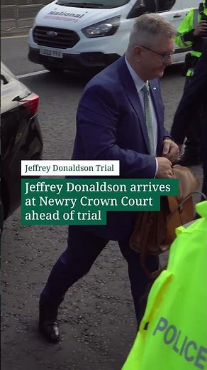 Jeffrey Donaldson arrives at court ahead of trial