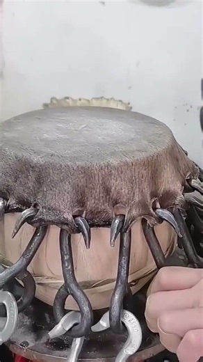 This is one way to properly install a skin when making a drum.#automobile