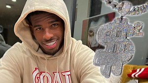 Deion Sanders' Son, Shedeur, Cops Iced-Out Pendant W/ 28 Carats Of Diamonds