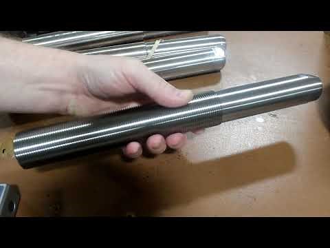 Setup for machining parallel flats on stainless round bar.