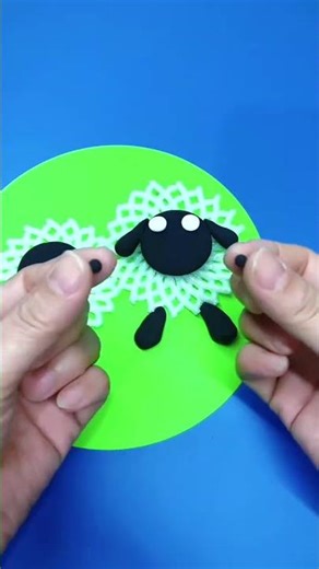 Make a little sheep with the fruit net. Don’t throw away the fruit net. Use the clay to make a c