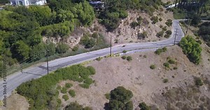 4k drone aerial footage motorcycle rider through hollywood hills mulholland drive los angeles california