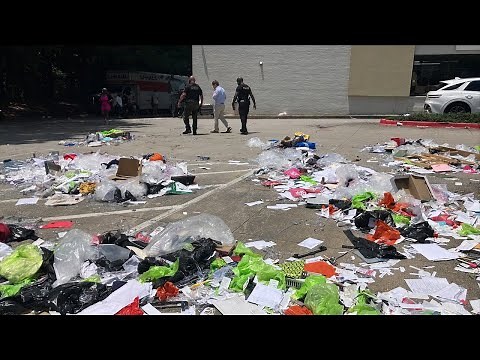 Crowd makes off with clothing after DeKalb County Plato’s Closet apparently evicted