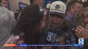 Dodgers players celebrate in the locker room after their World Series win