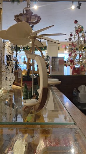 German pyramids are not only cool, they are packed with tradition. Originating in the Erzgebirge region of Germany, these handcrafted decorations spin using heat. When you light the candles at the base, the rising warm air turns the fan on top, slowly rotating the tiers below. Each level usually tells a story—nativity scenes, angels, forest animals, or scenes of daily life. Before Christmas trees became common, pyramids were often the centerpiece of holiday décor in German homes. Today, they ran