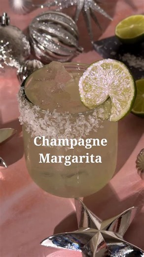 Stephanie Wahler on Instagram: "Champagne Margarita 🍾🍋‍🟩 .75 oz fresh lime juice .5 oz agave .5 oz orange liqueur 1.5 oz tequila 3 oz champagne Flaky sea salt for rim of glass Lime wheel with edible glitter for garnish Combine lime juice, agave, orange liqueur, and tequila in a cocktail shaker. Add ice and shake until cold. Strain into a glass filled with ice and top with champagne. #cocktailrecipes #nye #nyecocktails #holidaycocktails #nye2025"