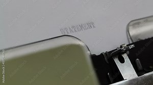 Typing out a statement title on a typewriter Stock Video