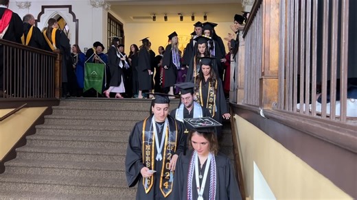Last commencement post! We're not sure when USF's "graduate send-off" began, but as grads process from Tower Hall to the Sullivan Center for the ceremony, they are met along the way by faculty members and the board of trustees, who applaud them for making it to this moment. Comment below if you remember being part this tradition when you graduated! | University of St. Francis