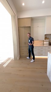 At first glance, it’s just a beautiful kitchen cabinet… but behind this custom panel lies something unexpected—a full golf simulator! This seamless design keeps the space elegant while adding a touch of luxury and fun while also keeping the kitchen symmetrical! 👀✨ | AFT Construction