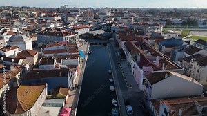 Beautiful aerial view of Aveiro city in Portugal. Aveiro Water canal of Ria de Aveiro with typical boats and tourists