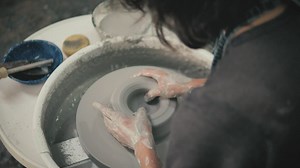 Woman using pottery wheel - Free Stock Video