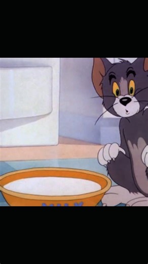 Tom nd jerry fan Base on Instagram: "Jerry and Tuffy are in for a bumpy ride! 🎢🐭 . . . ​"Classic 1940s-style 2D animation. A large grey cat with a mischievous grin is rapidly slurping milk from a yellow bowl labeled 'MILK' in blue letters. The slurping is so intense it creates a whirlpool effect inside the bowl. Two tiny mice are trapped inside the liquid, spinning around helplessly as the level drops. The art style features soft, hand-painted backgrounds and high-energy slapstick movements." 