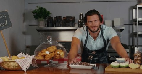 clip-3997474525-baker-leaning-on-counter-animated-bar-graph-overlay