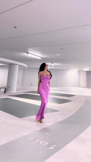 Elegant Model in Strapless Purple Dress in Parking Garage