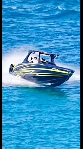 Mystic power boat makes a last second detour and avoids the Haulover Inlet