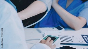 Doctor using sphygmomanometer with stethoscope checking blood pressure to a patient in the hospital.