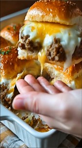 Cheesy Baked Beef Sliders These warm, cheesy sliders have that familiar, comforting flavor of a baked party sandwich — simple to make and perfect for an easy family dinner or sharing with friends. What You'll Need For the Beef Filling 1 lb ground beef 1 small onion, finely chopped 2 cloves garlic, minced 1 tablespoon olive oil 1 teaspoon Worcestershire sauce 1/2 teaspoon salt 1/2 teaspoon black pepper For the Buns and Assembly 8 slider buns or dinner rolls 8 slices mozzarella cheese 2 tablespoon
