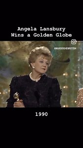 Angela Lansbury didn't win an Emmy for her portrayal of Jessica Fletcher on Murder, She Wrote, but she did win four Golden Globes for it. Here she is accepting her Golden Globe in 1990. | Minerva Vazquez