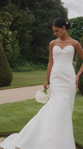 A sleek, chic neckline accentuates a stylish strapless bodice on the Mikado mermaid Stefano by Anna Sorrano. Is this the perfect dress for you? 😍 Check it out now at www.wed2b.com/stefano! | wed2b