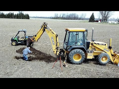 Fixing a "Suck Hole" - Repairing Broken Down Farm Drainage Tile with the Backhoe