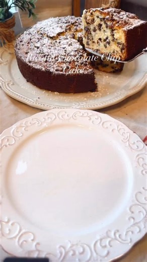 Dena Fenza -🇮🇹🇺🇸Mamma🧿 on Instagram: "My viral Chocolate Chip Ricotta Cake is by far a favorite of you guys. So many of you have made it, and each time you send me a message about it, I am so ecstatic. It is a great cake to make for the holidays. It is easy to put together and it is so incredibly delicious. The ricotta makes this cake so moist. Full recipe below Ingredients (Serves 10) 1 ¼ cups Sugar 1 ¾ Cups All Purpose Flour, plus 2 tbsp for combining with chocolate chips 2 tsp. Baking Po