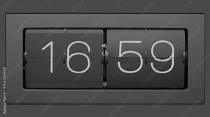 Flip clock quickly flips. .Retro flip clock changing from 16:59 to 17:00. Slow motion. Close up.